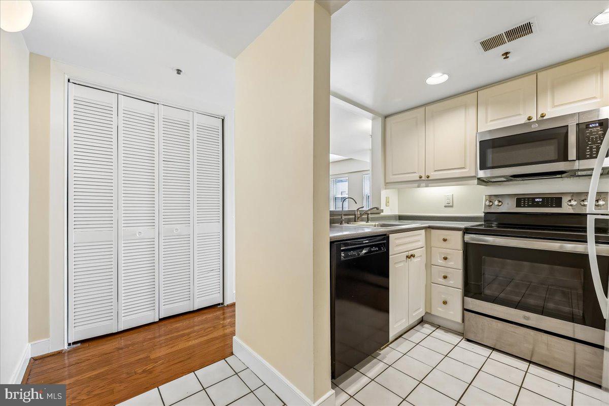 1727 R Street Northwest, Unit 201 Washington, DC 20009 - Photo 3 of 49 Kitchen and hallway leading into the apartment