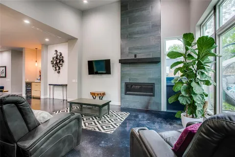 a living room with furniture and a potted plant
