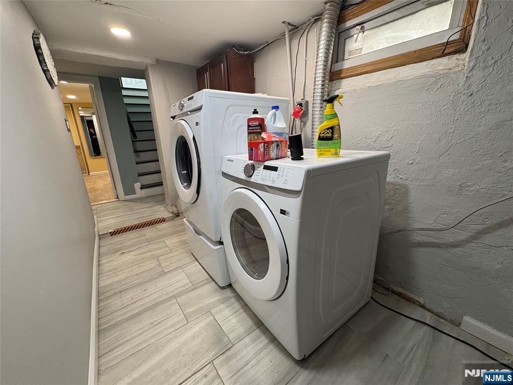 282 Harding Avenue, Unit 1 Teaneck, NJ 07666 - Photo 21 of 21 a utility room with dryer and washer