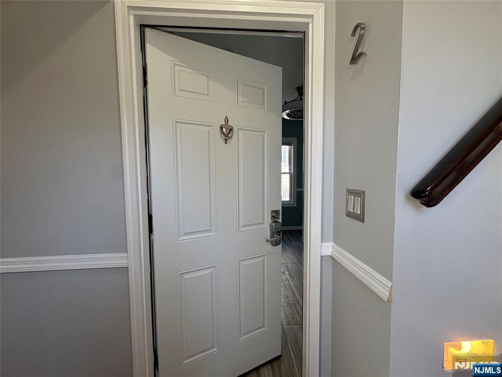 282 Harding Avenue, Unit 1 Teaneck, NJ 07666 - Photo 6 of 21 a view of a livingroom from a hallway