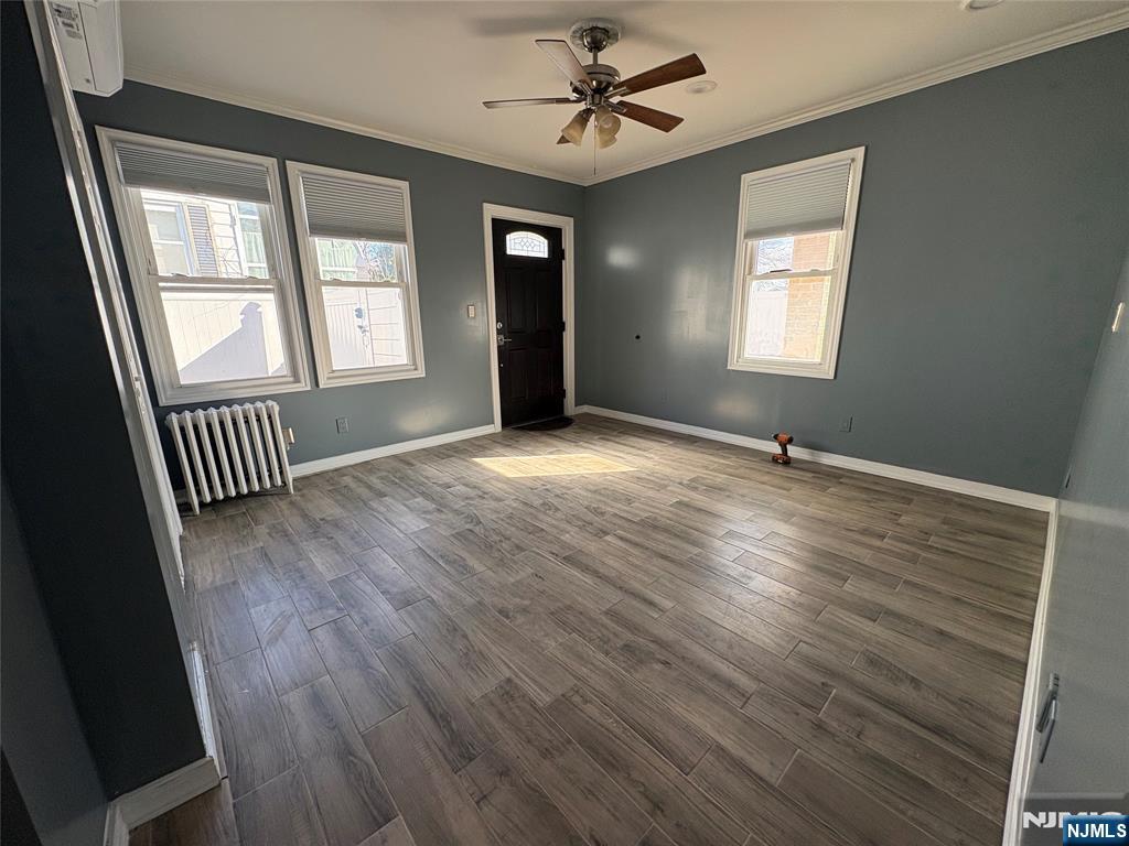 282 Harding Avenue, Unit 1 Teaneck, NJ 07666 - Photo 10 of 21 wooden floor in an empty room with a window