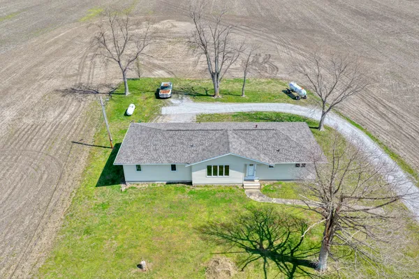 a aerial view of a house with a yard