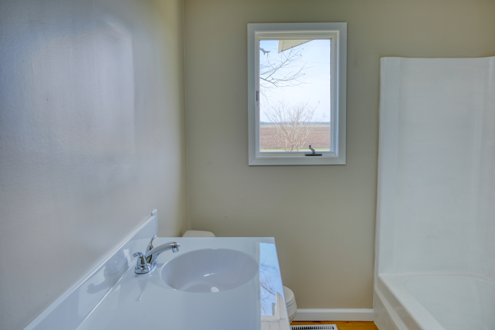 676 Swan Pond Road Jacob, IL 62950 - Photo 11 of 42 a bathroom with a sink and a window