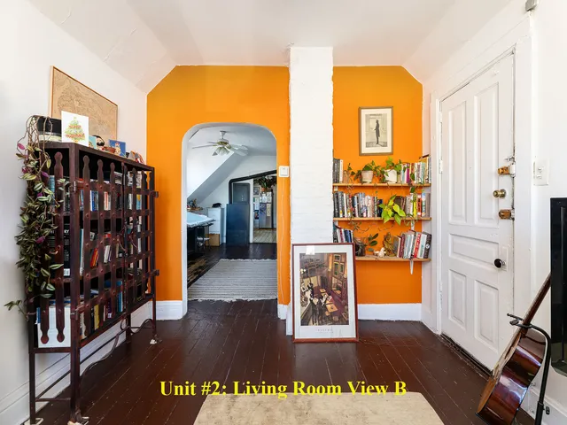 a view of a living room and wooden floor