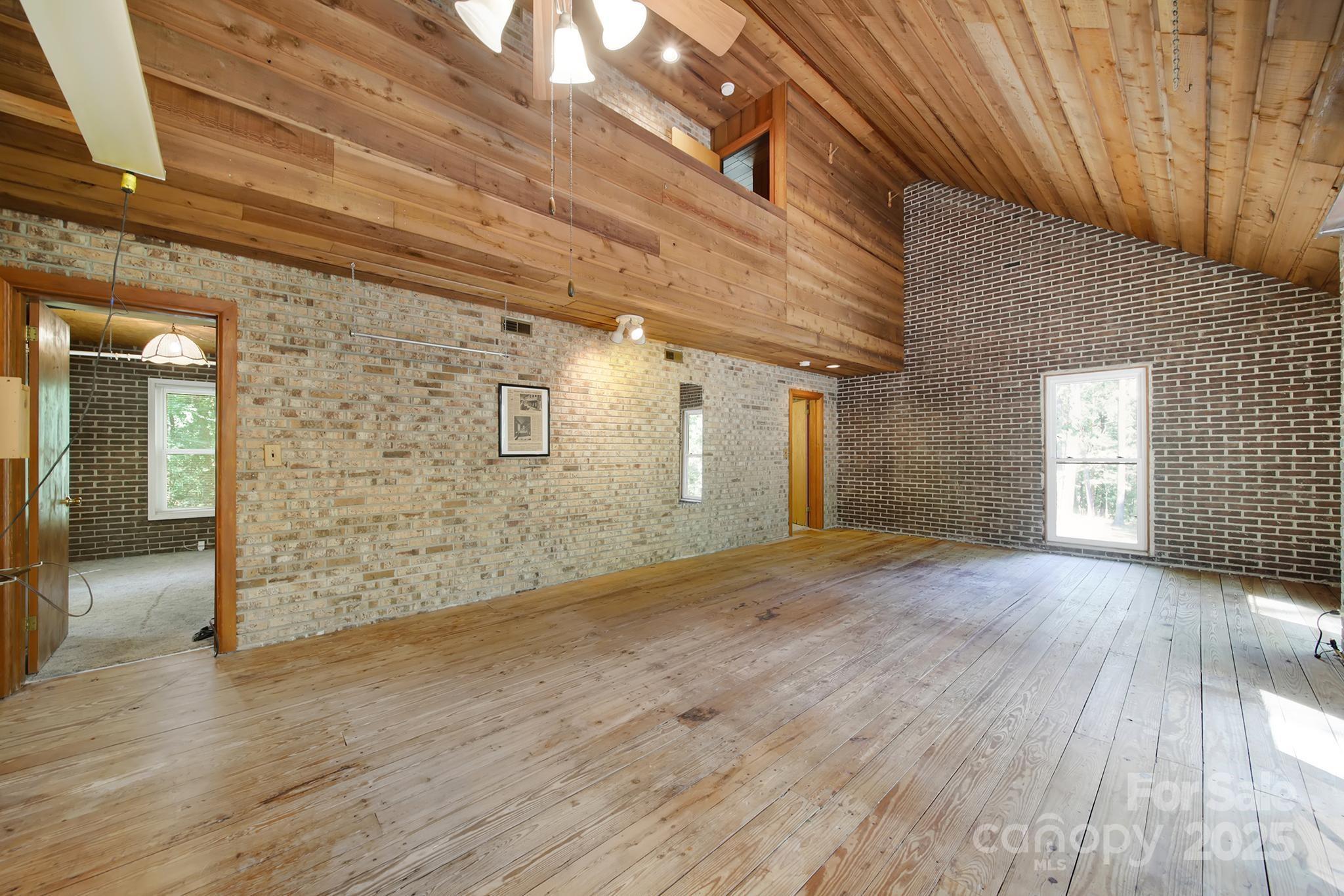 4768 Old Church Road Lancaster, SC 29720 - Photo 12 of 40 a view of an empty room with wooden floor and a window