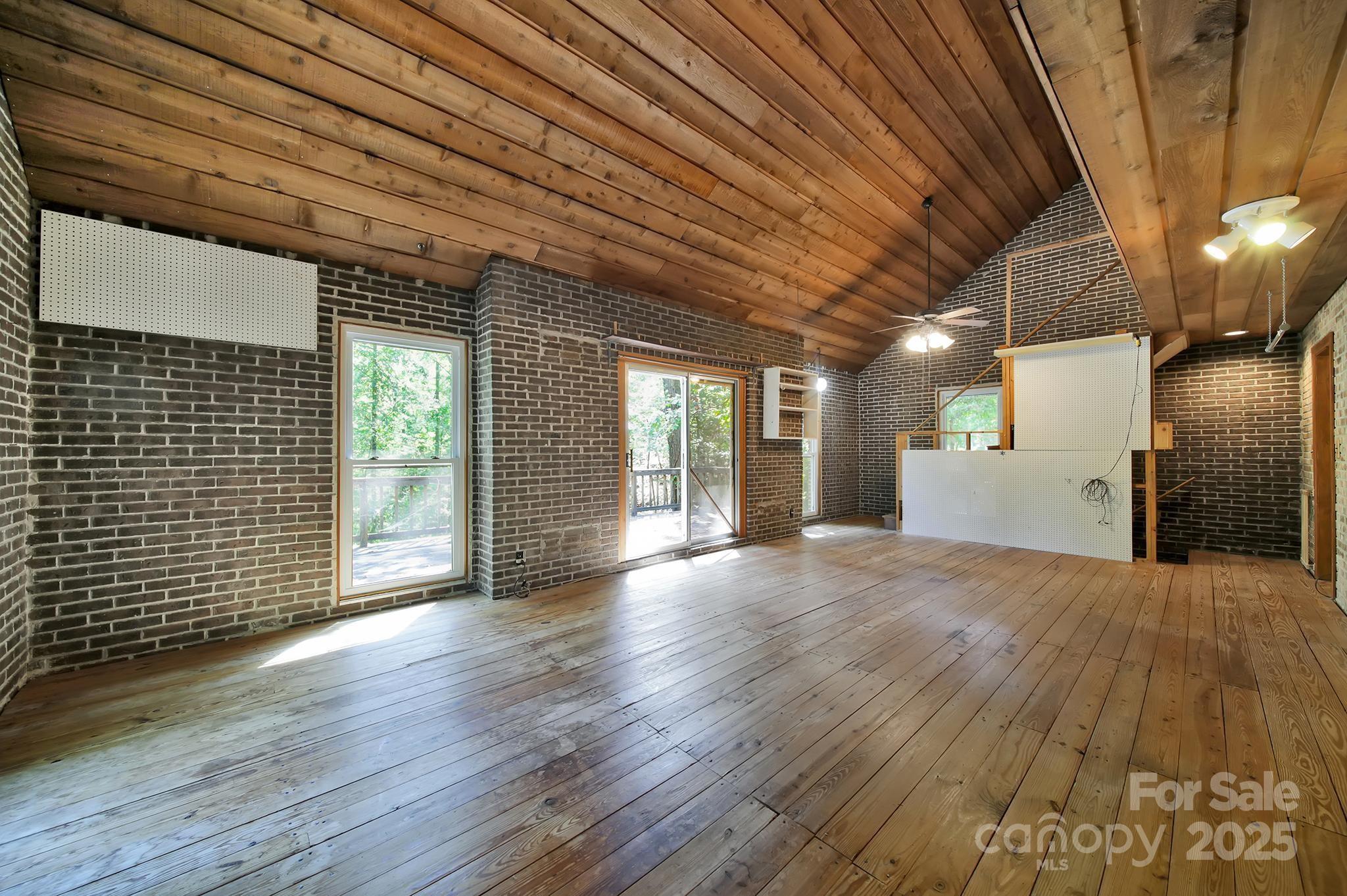 4768 Old Church Road Lancaster, SC 29720 - Photo 13 of 40 a view of an empty room with wooden floor and a window