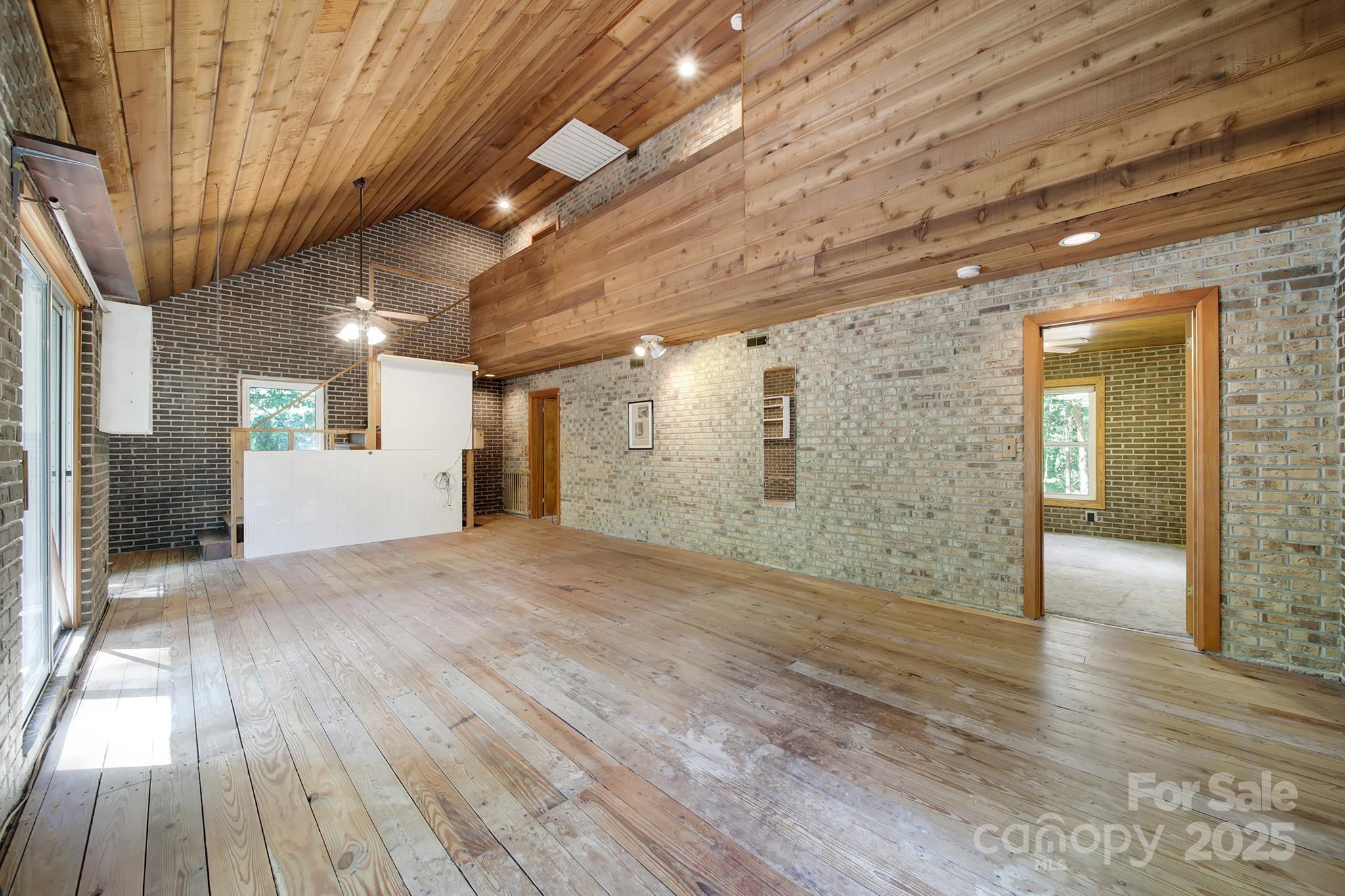 4768 Old Church Road Lancaster, SC 29720 - Photo 15 of 40 a view of a hallway with wooden floor