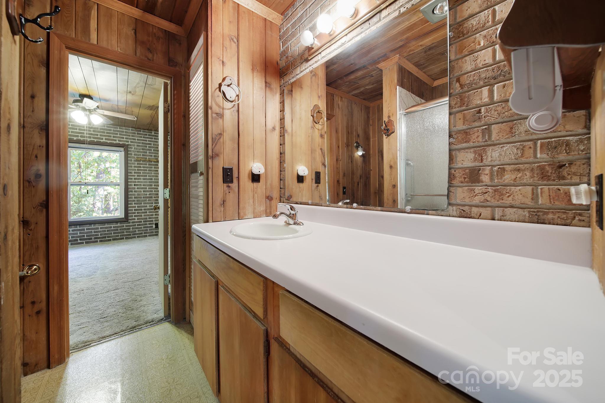 4768 Old Church Road Lancaster, SC 29720 - Photo 17 of 40 a bathroom with a granite countertop sink and a mirror