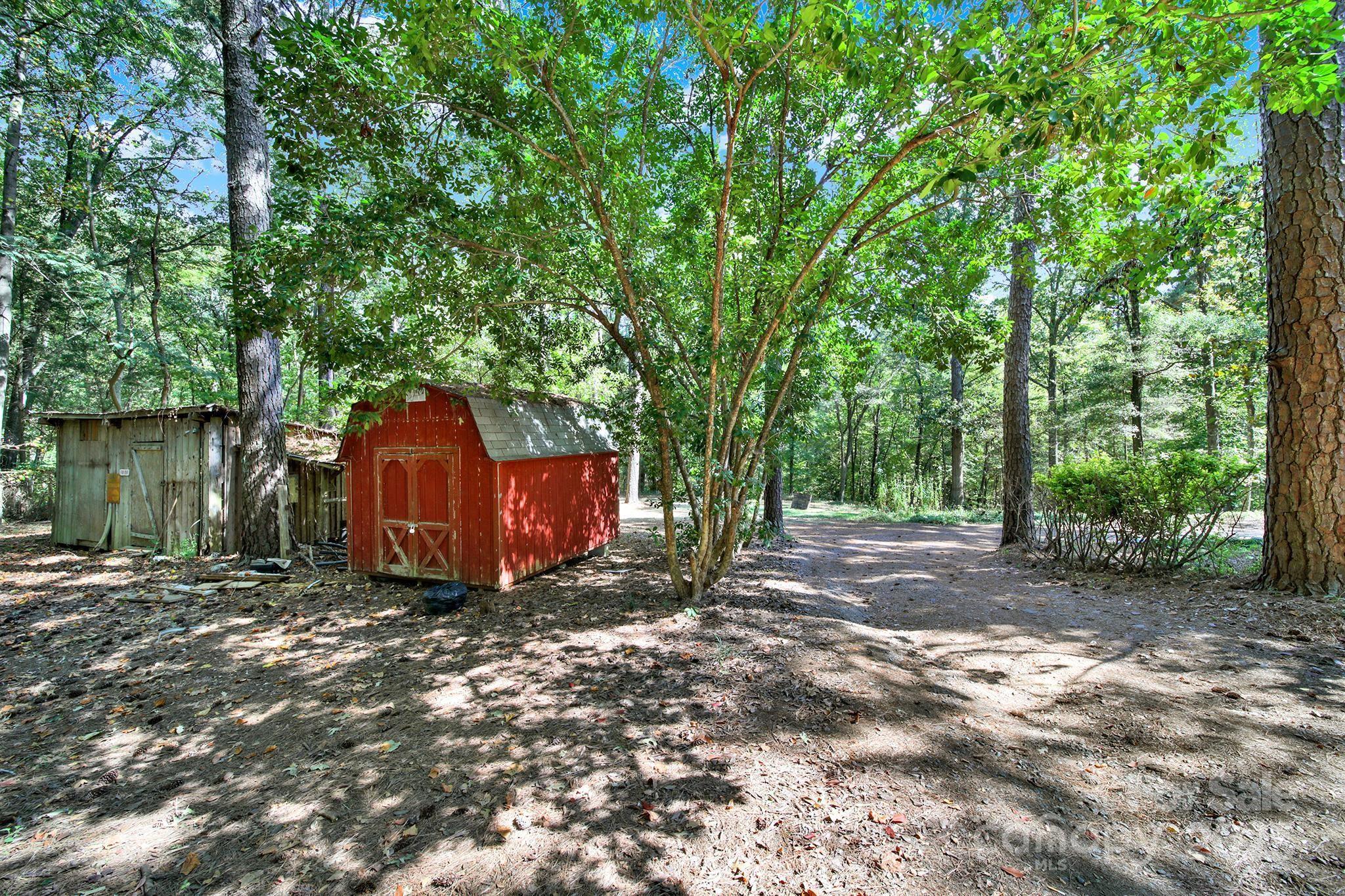4768 Old Church Road Lancaster, SC 29720 - Photo 29 of 40 a view of a barn in the middle of a yard