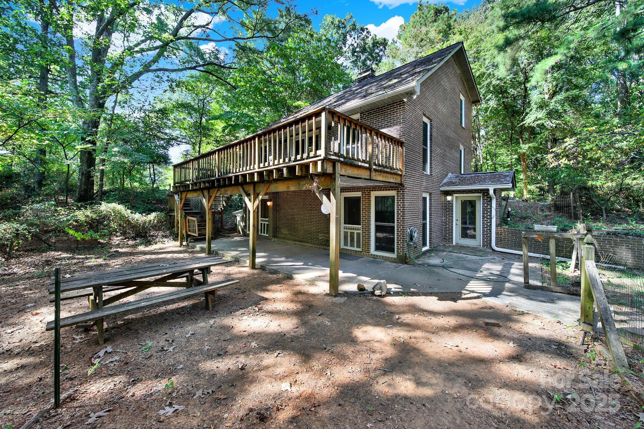4768 Old Church Road Lancaster, SC 29720 - Photo 30 of 40 a view of a house with backyard sitting area and garden