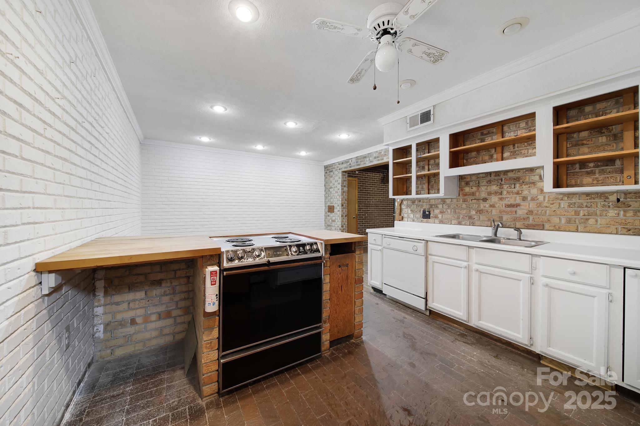 4768 Old Church Road Lancaster, SC 29720 - Photo 3 of 40 a kitchen with stainless steel appliances granite countertop a stove and a sink