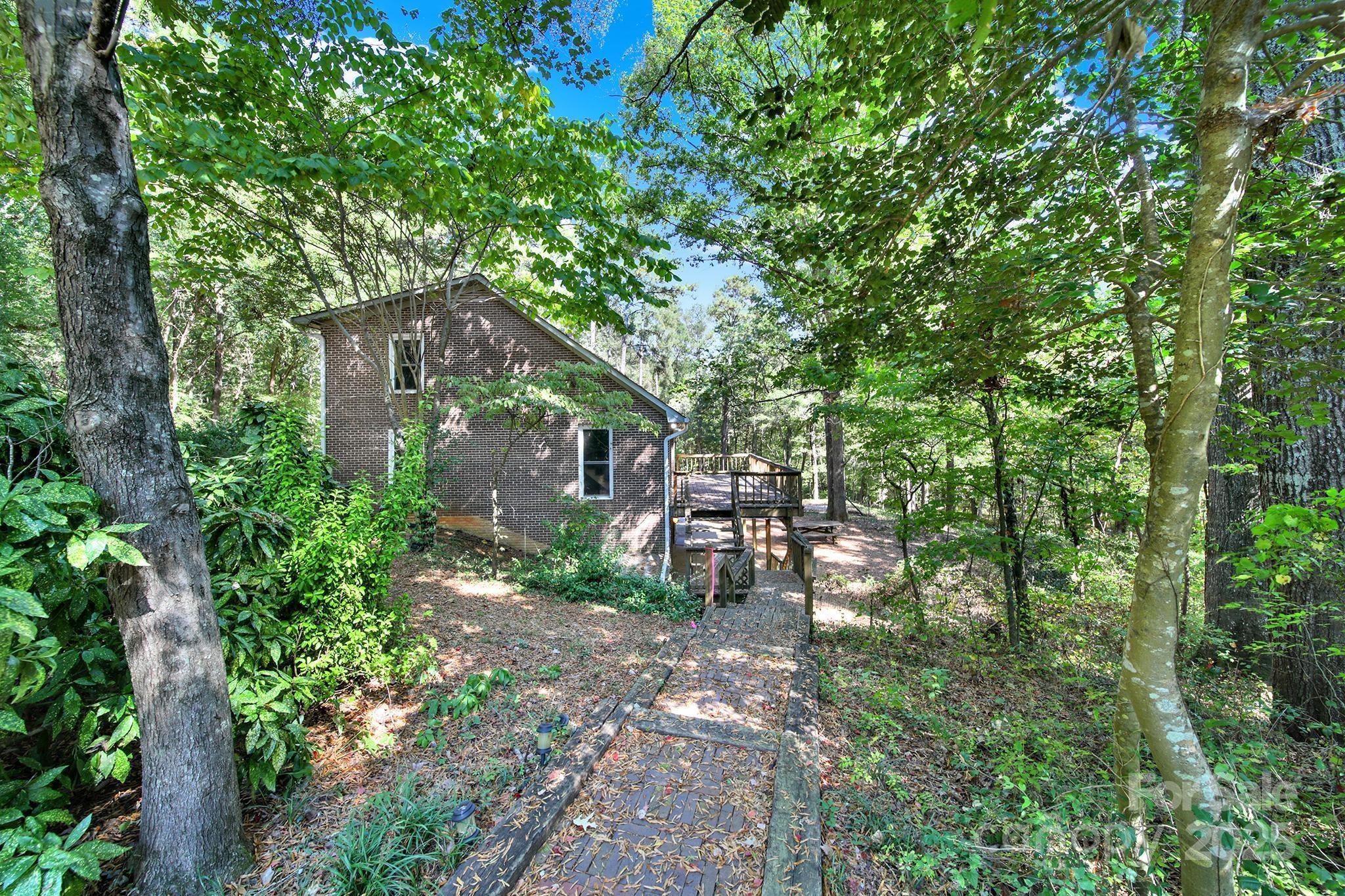 4768 Old Church Road Lancaster, SC 29720 - Photo 32 of 40 a backyard of a house with table and chairs