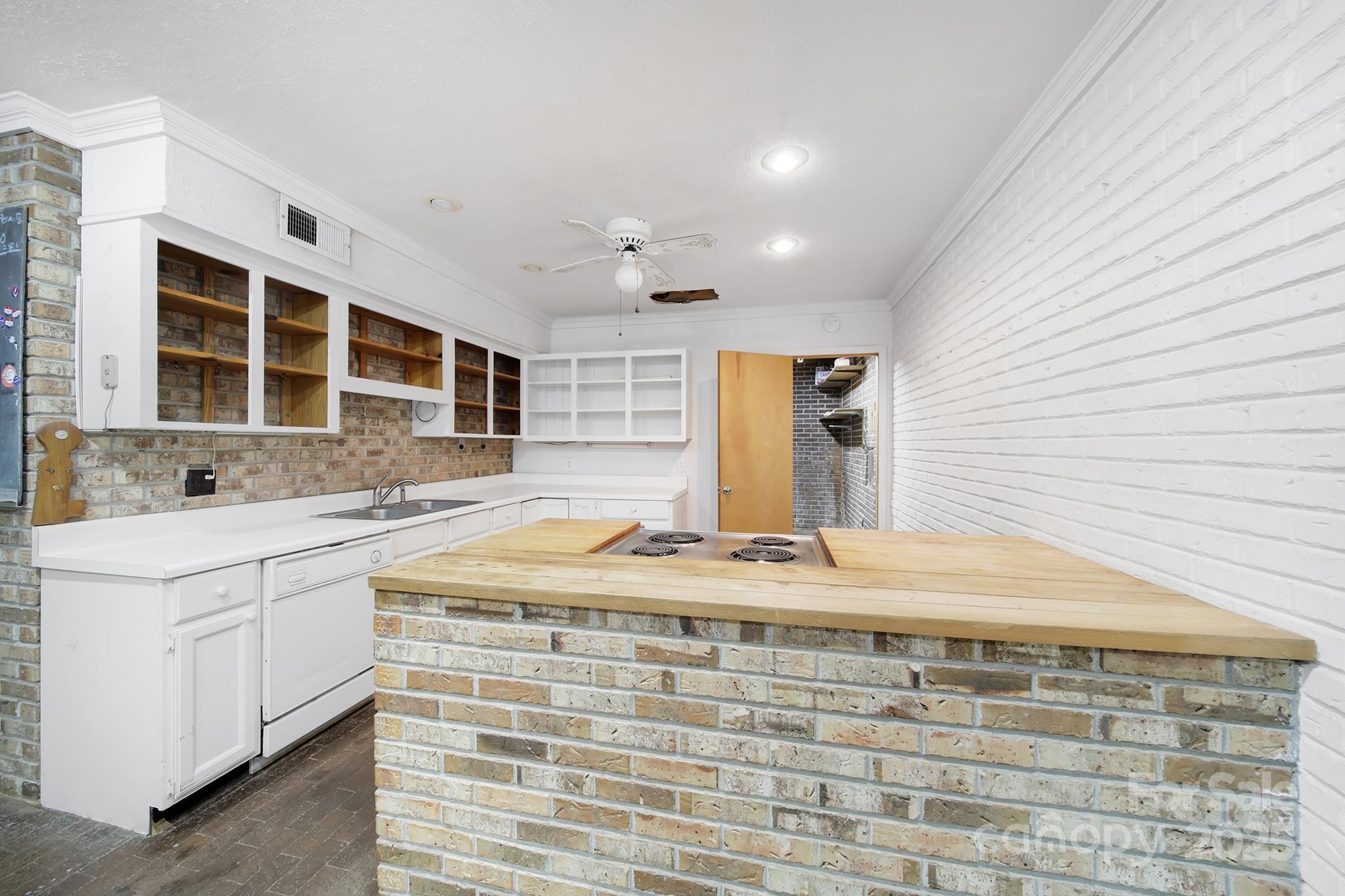 4768 Old Church Road Lancaster, SC 29720 - Photo 4 of 40 a kitchen with stainless steel appliances granite countertop a sink and cabinets