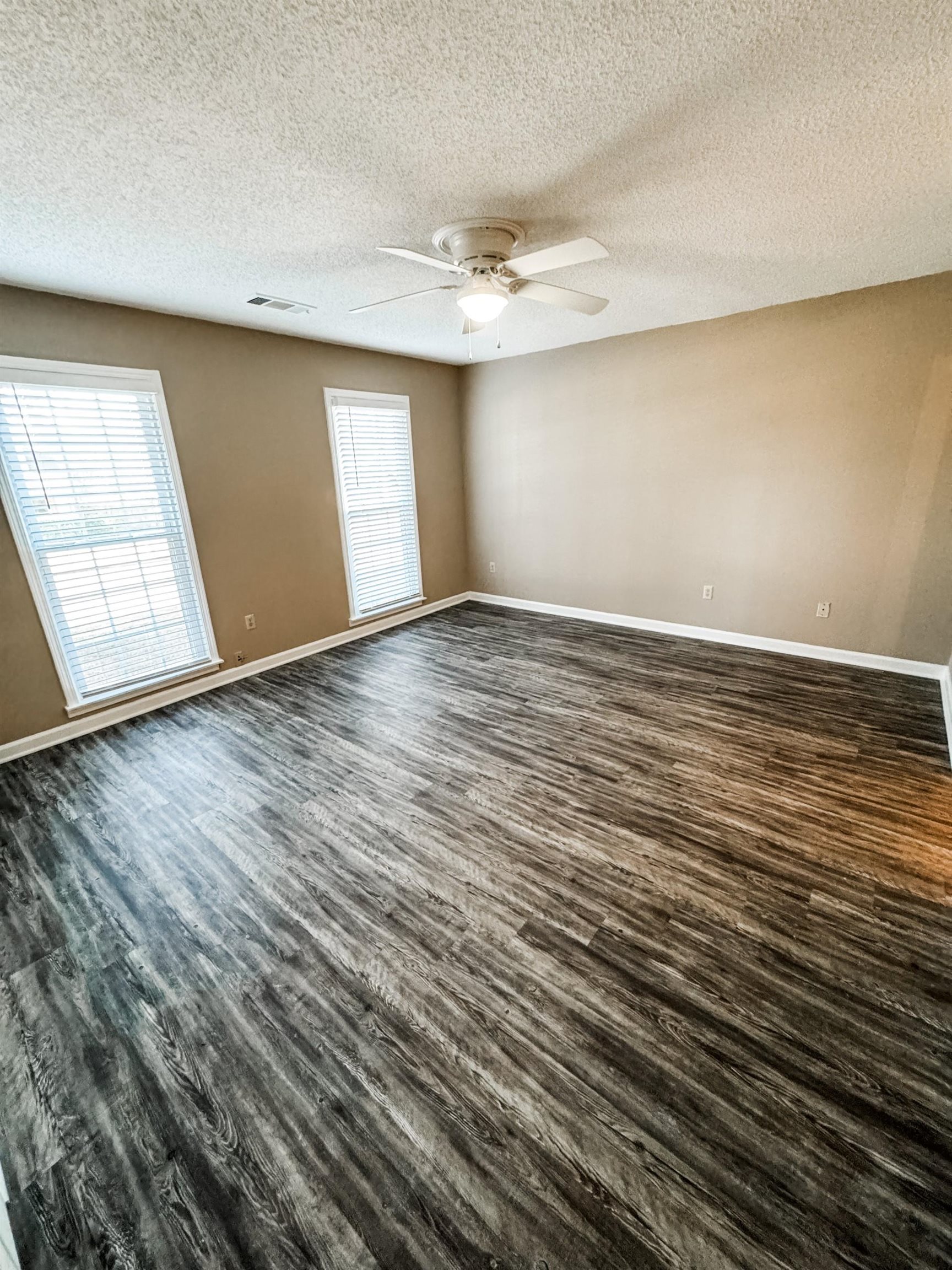 408 Great Falls Road Collierville, TN 38017 - Photo 8 of 14 an empty room with wooden floor and windows