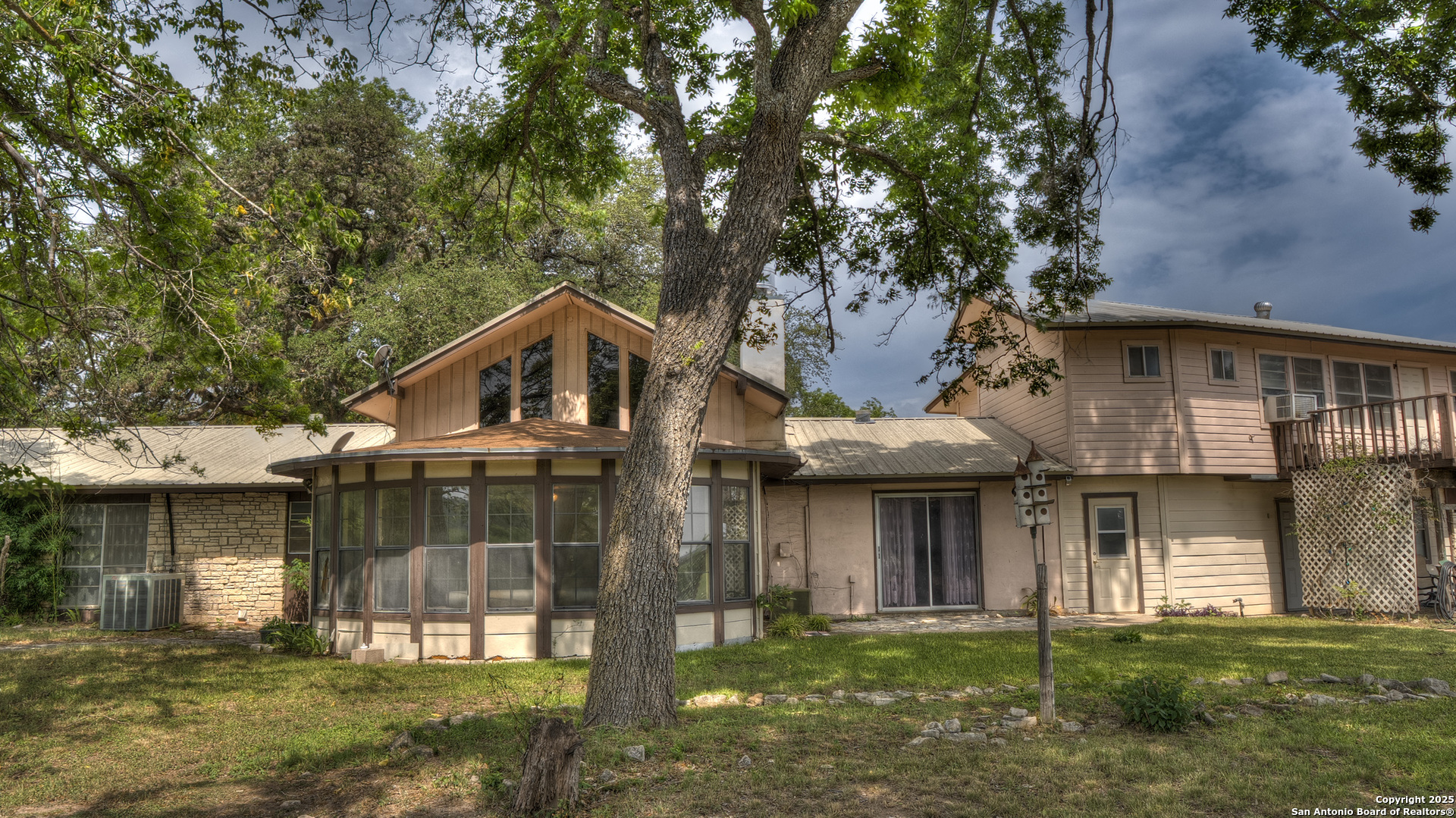 6671 Ranch Road 1120 Rio Frio, TX 78879 - Photo 14 of 47 a front view of a house with a yard