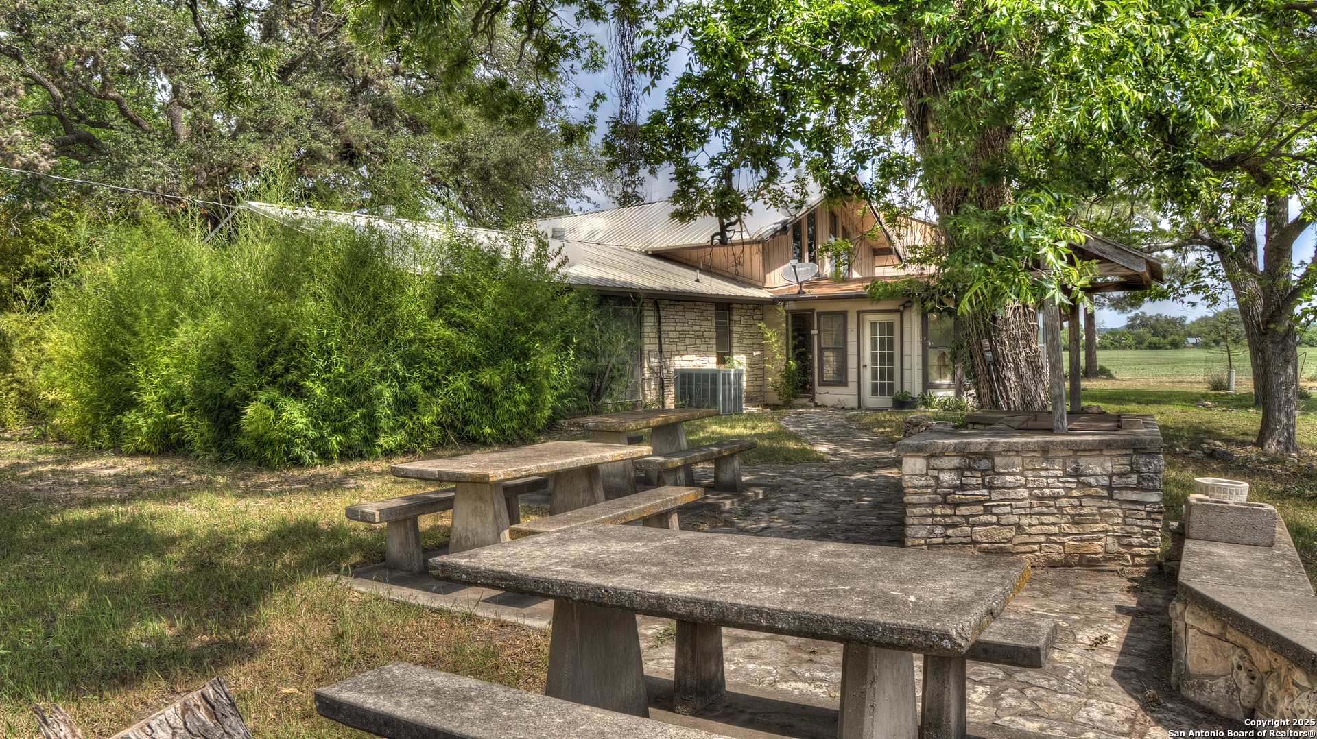 6671 Ranch Road 1120 Rio Frio, TX 78879 - Photo 16 of 47 a front view of a house with garden