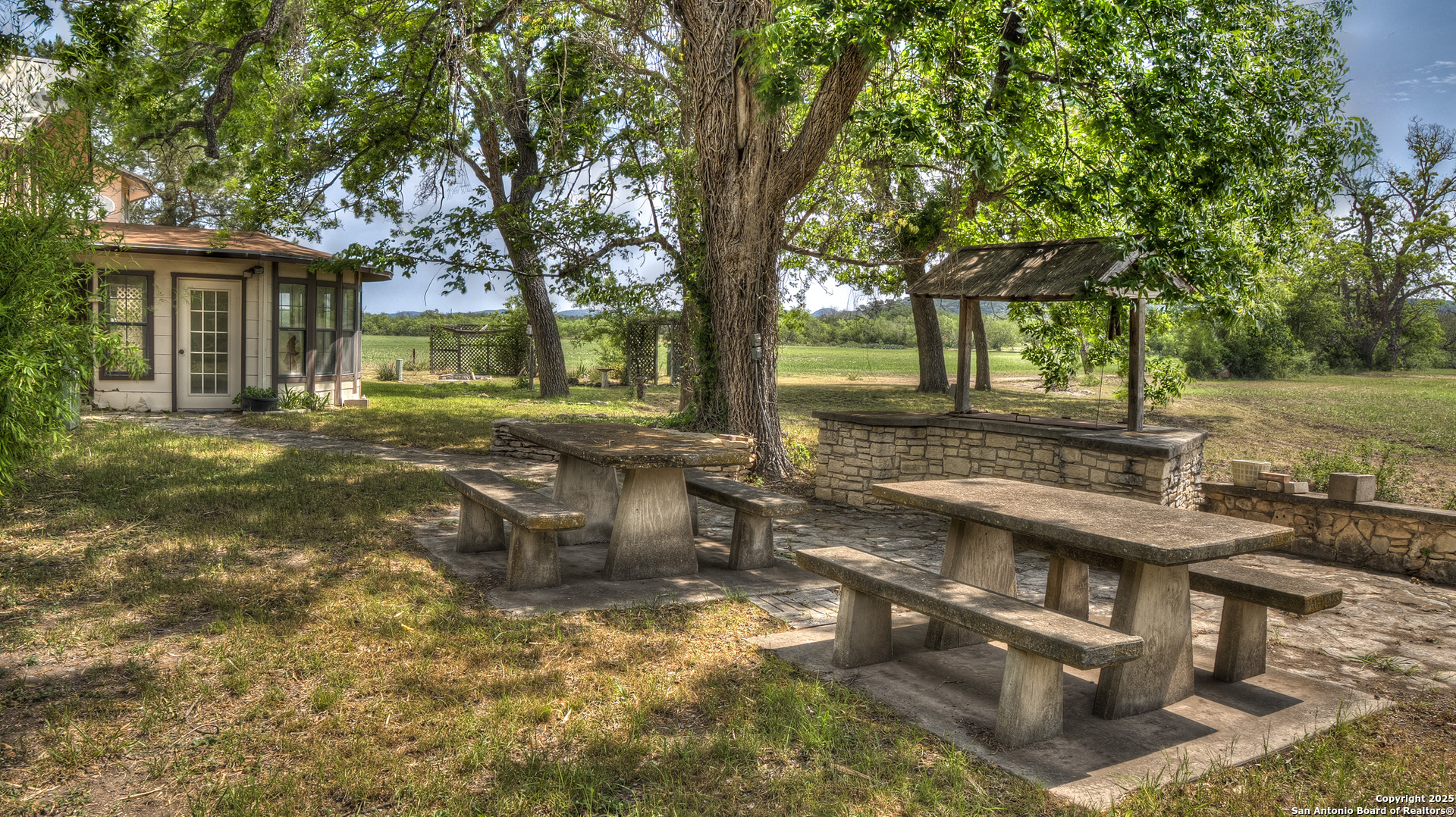 6671 Ranch Road 1120 Rio Frio, TX 78879 - Photo 17 of 47 a view of a house with backyard and sitting area