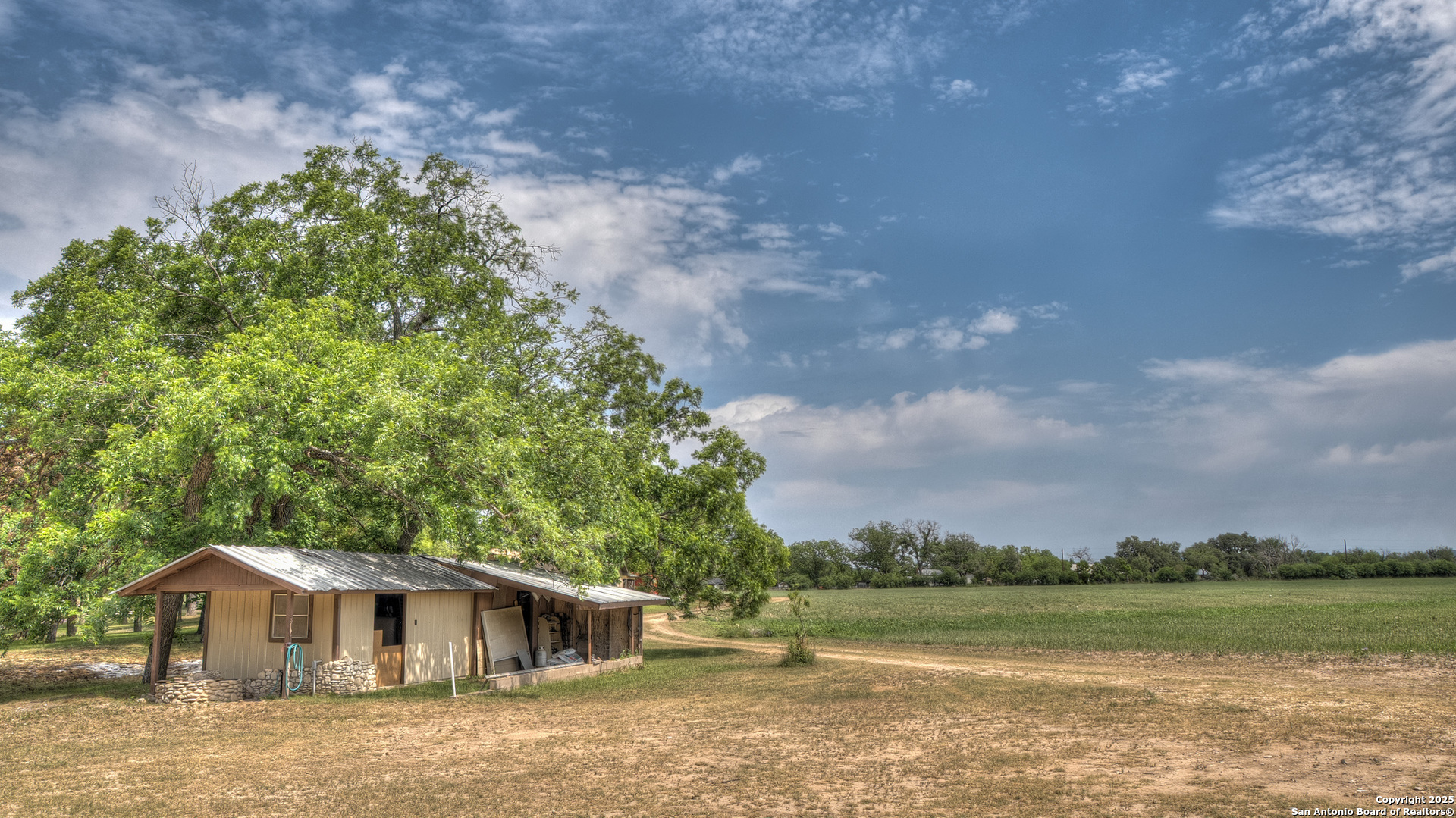 6671 Ranch Road 1120 Rio Frio, TX 78879 - Photo 20 of 47 a front view of a house with a garden