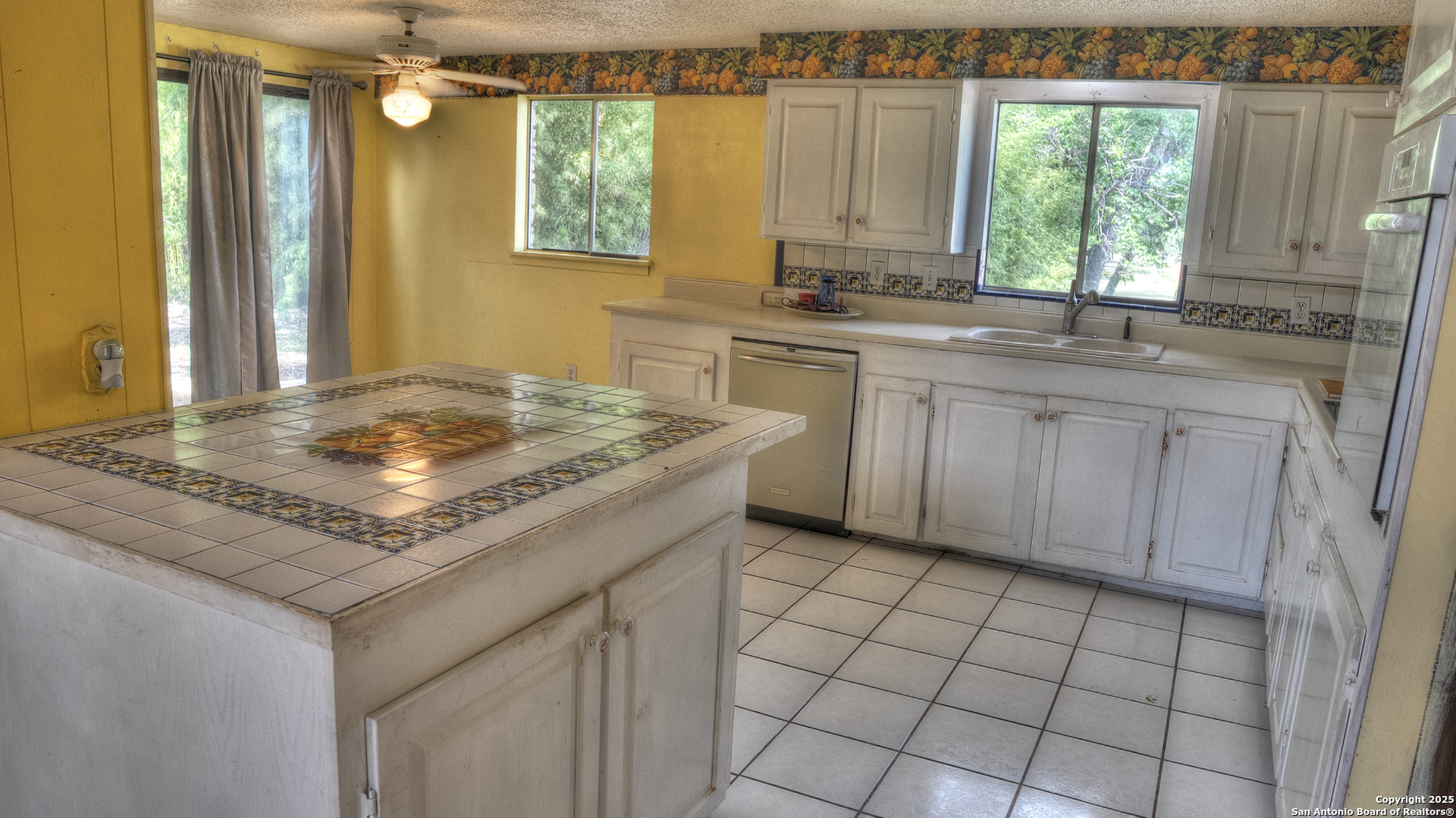 6671 Ranch Road 1120 Rio Frio, TX 78879 - Photo 27 of 47 a kitchen with sink cabinets and window
