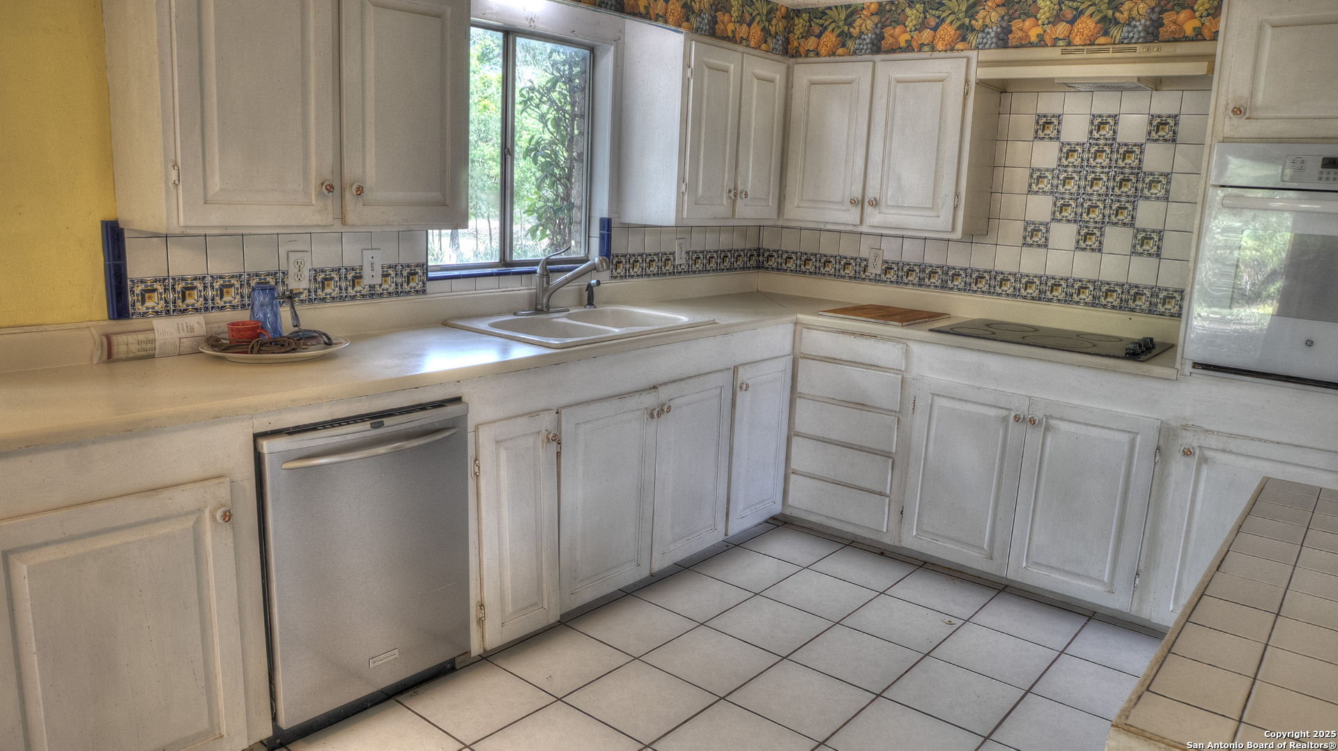 6671 Ranch Road 1120 Rio Frio, TX 78879 - Photo 28 of 47 a kitchen with a sink cabinets and window