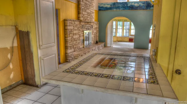a bathroom with a mirror and a shower