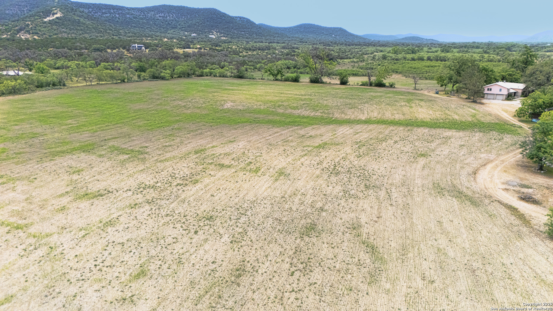 6671 Ranch Road 1120 Rio Frio, TX 78879 - Photo 3 of 47 a view of an ocean with a mountain in the background