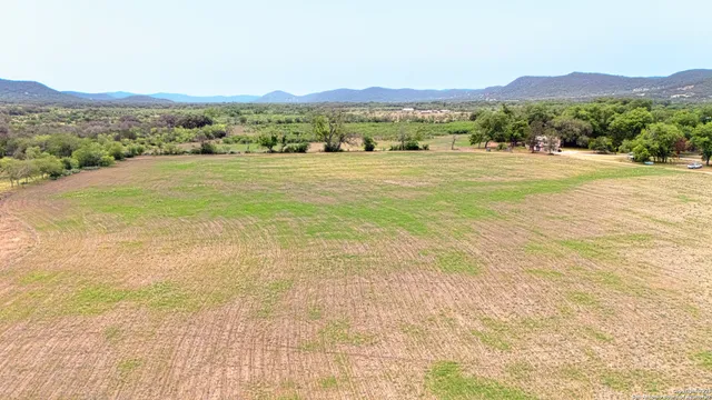 a view of an ocean and a mountain