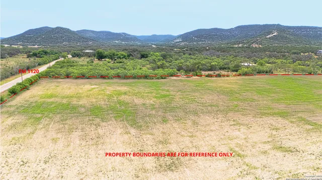 a view of an ocean and a mountain