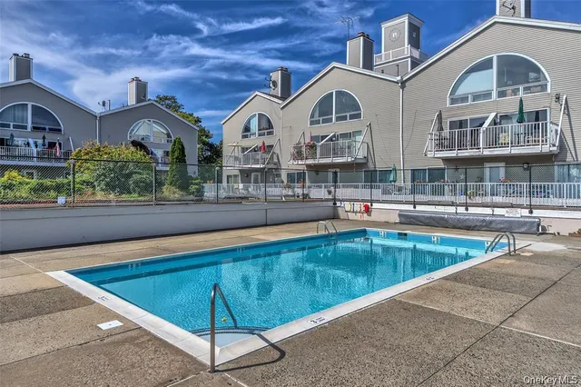 a view of a building with a swimming pool
