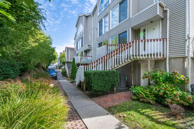 a backyard of a house with a garden and plants