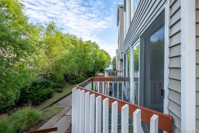 a view of street from balcony