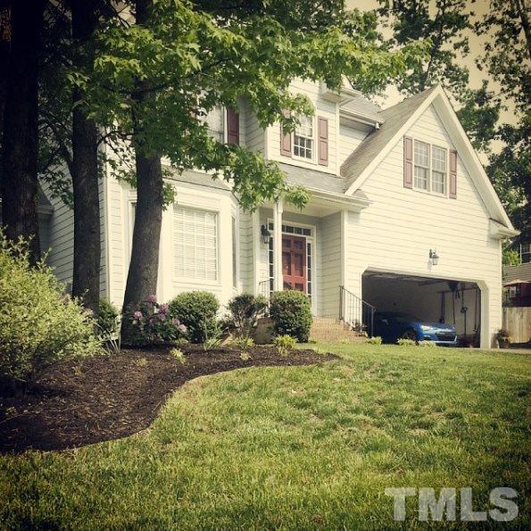 9425 Stone Mountain Road Raleigh, NC 27613 - Photo 2 of 25 a front view of a house with yard and green space