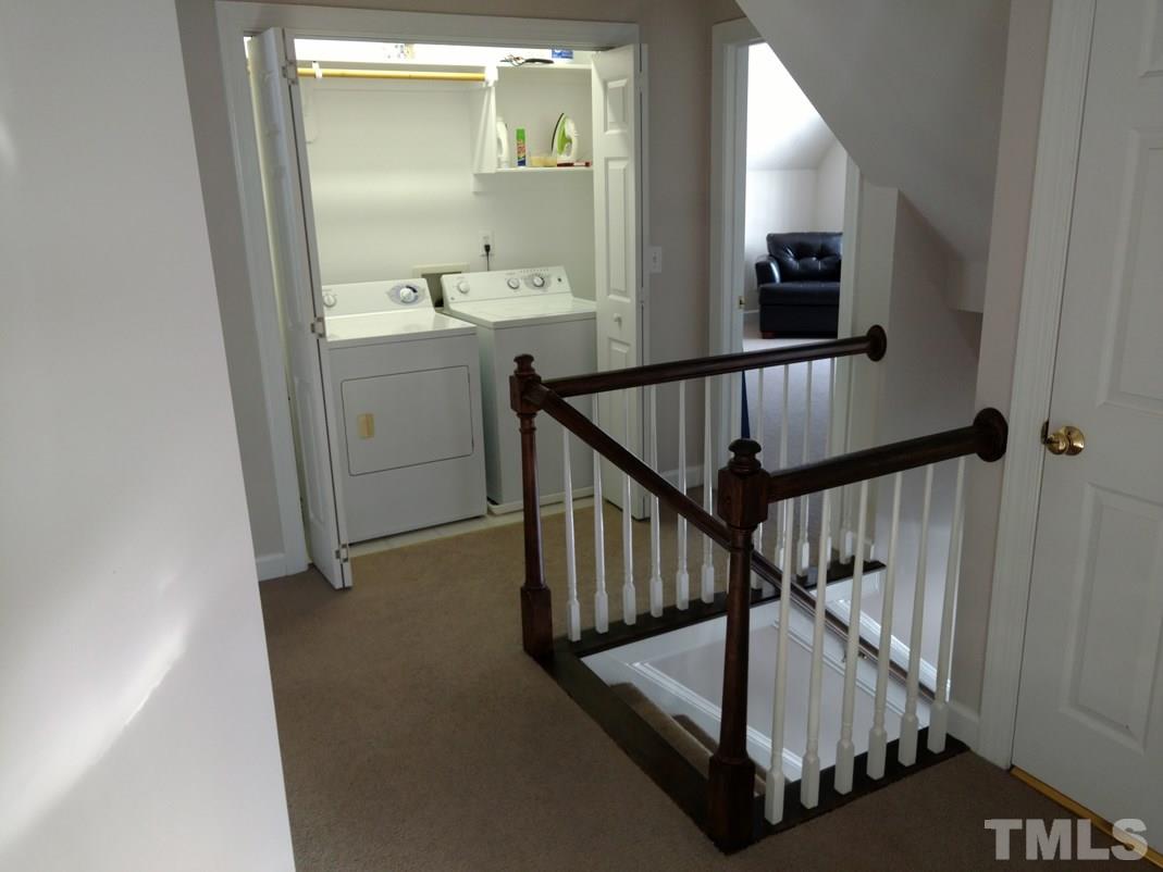 9425 Stone Mountain Road Raleigh, NC 27613 - Photo 13 of 25 a view of entryway and hall with wooden floor