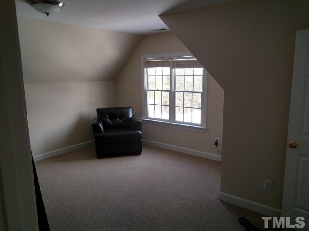 9425 Stone Mountain Road Raleigh, NC 27613 - Photo 14 of 25 an empty room with a window
