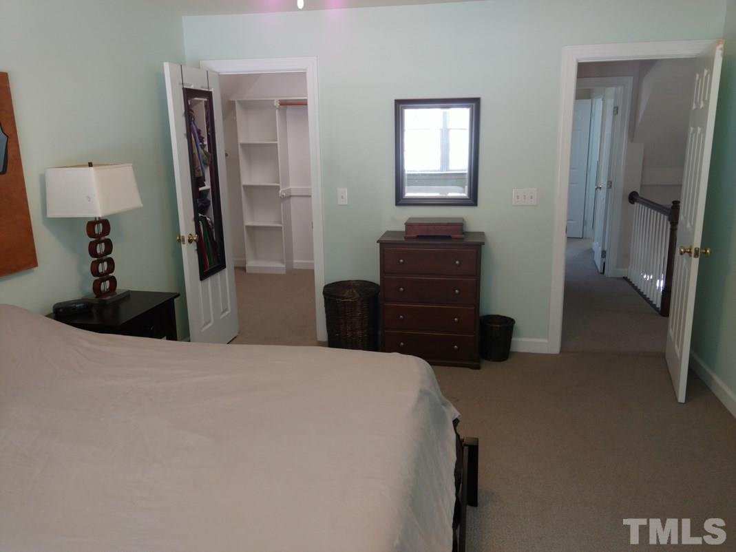 9425 Stone Mountain Road Raleigh, NC 27613 - Photo 20 of 25 a bedroom with a bed and a closet