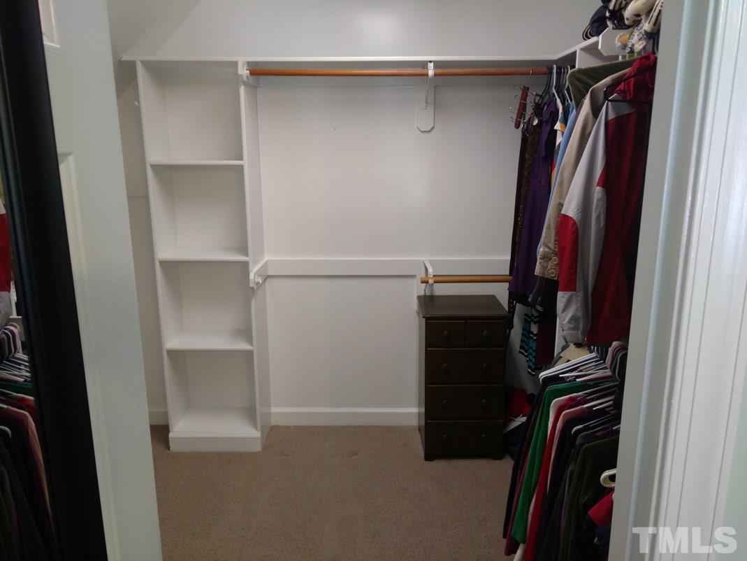 9425 Stone Mountain Road Raleigh, NC 27613 - Photo 22 of 25 a view of walk in closet with clothes and shoes