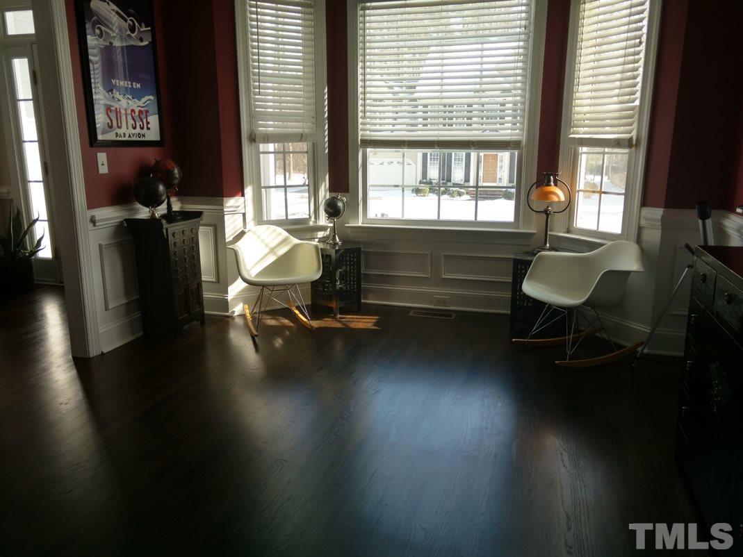 9425 Stone Mountain Road Raleigh, NC 27613 - Photo 5 of 25 a living room with furniture window and wooden floor