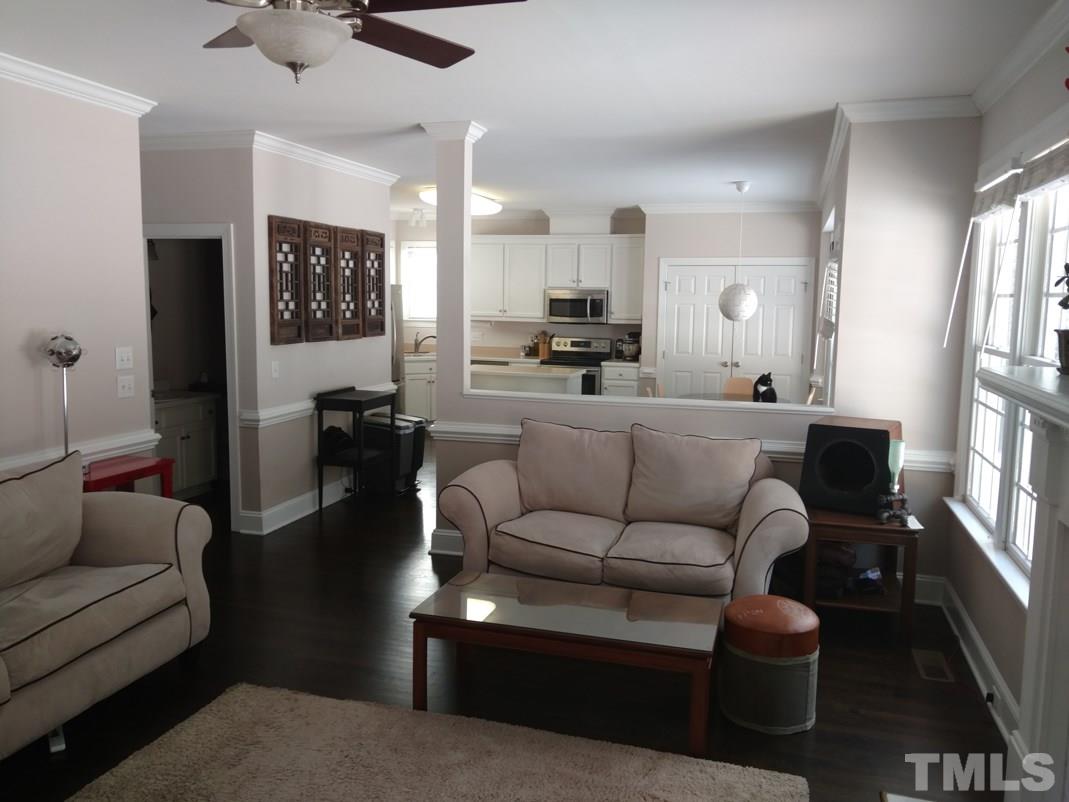 9425 Stone Mountain Road Raleigh, NC 27613 - Photo 9 of 25 a living room with furniture and a large window