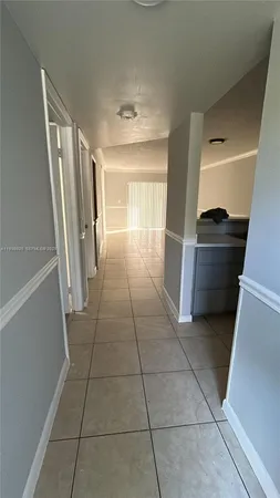 a view of an empty room with stairs