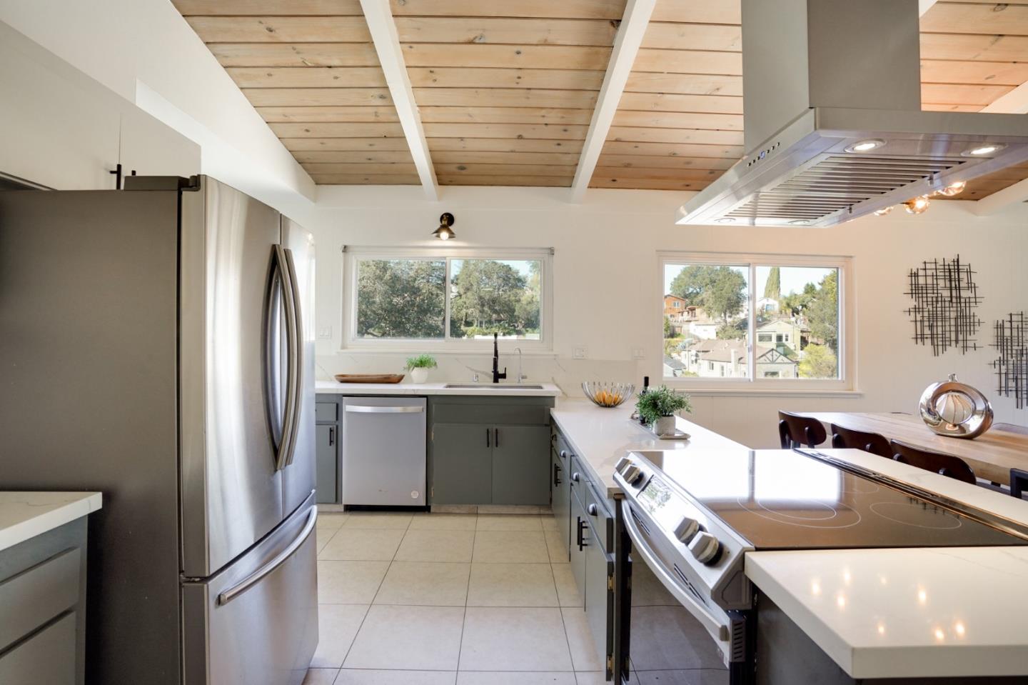 4615 Redding Street Oakland, CA 94619 - Photo 11 of 49 a kitchen with stainless steel appliances granite countertop a sink stove and refrigerator