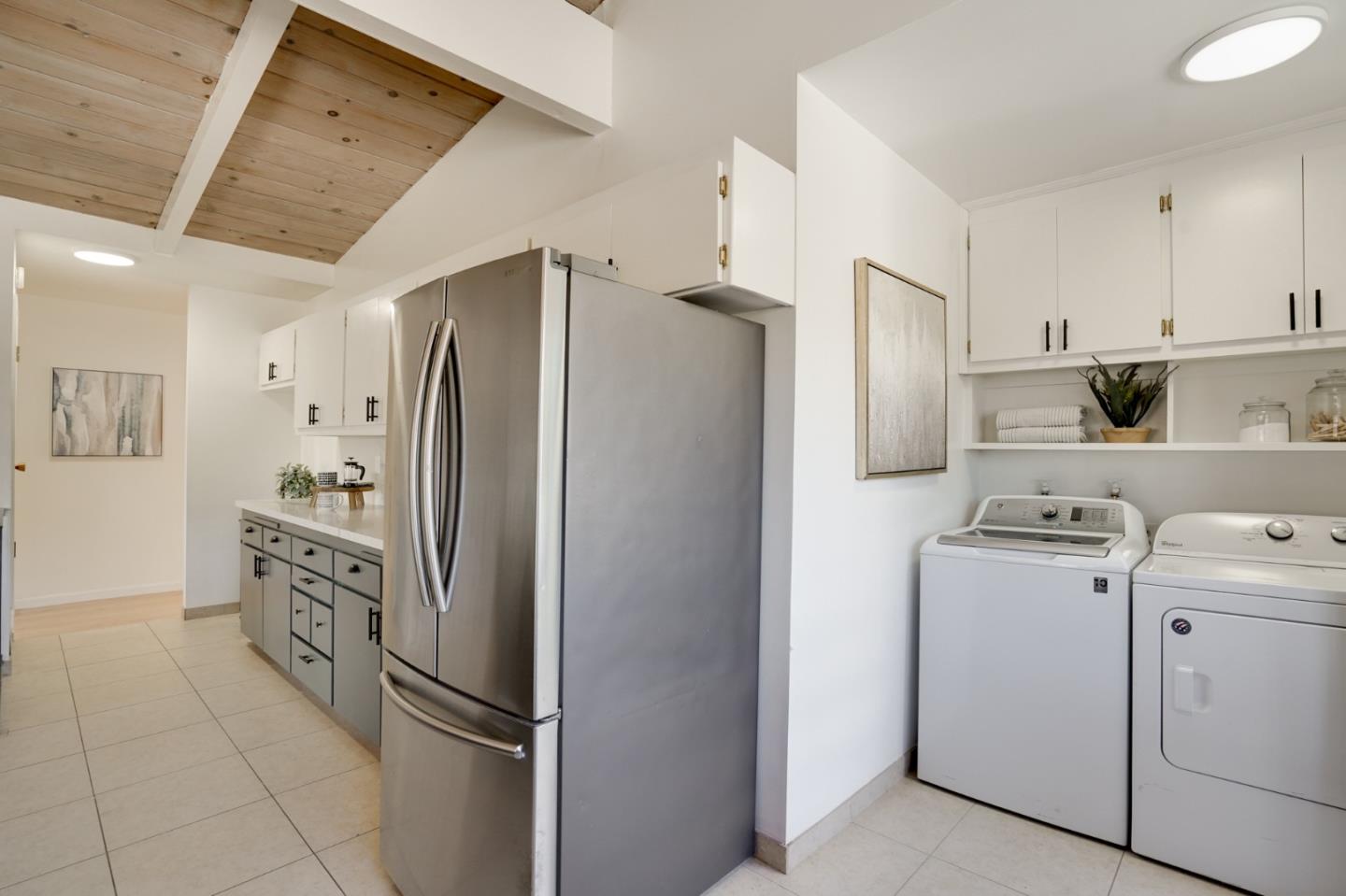 4615 Redding Street Oakland, CA 94619 - Photo 12 of 49 a kitchen with stainless steel appliances a refrigerator and a stove top oven