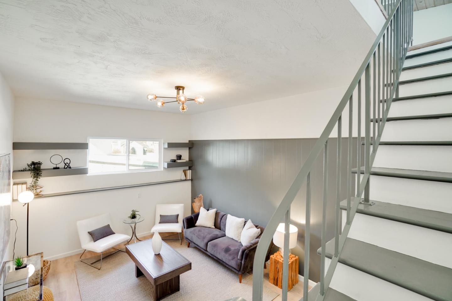 4615 Redding Street Oakland, CA 94619 - Photo 15 of 49 a living room with furniture and a chandelier