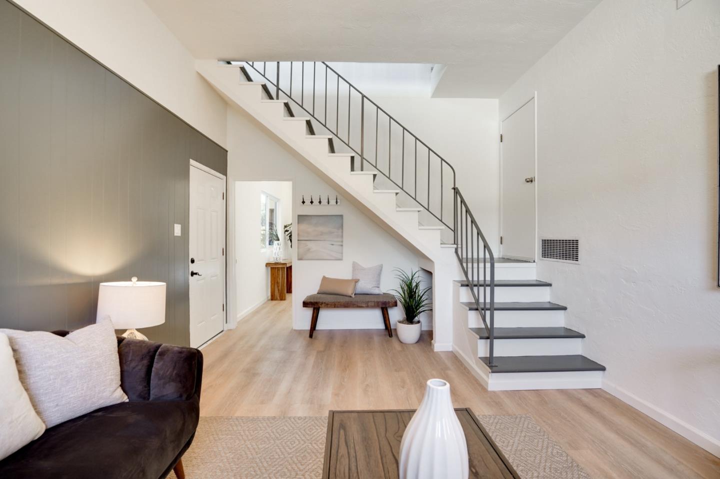 4615 Redding Street Oakland, CA 94619 - Photo 16 of 49 a living room with furniture and a wooden floor