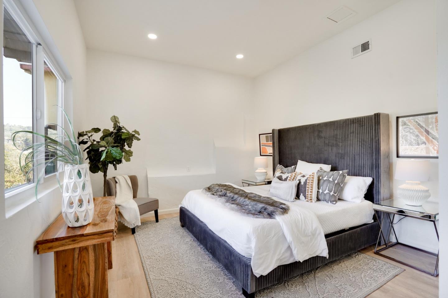 4615 Redding Street Oakland, CA 94619 - Photo 28 of 49 a bedroom with a bed and a potted plant