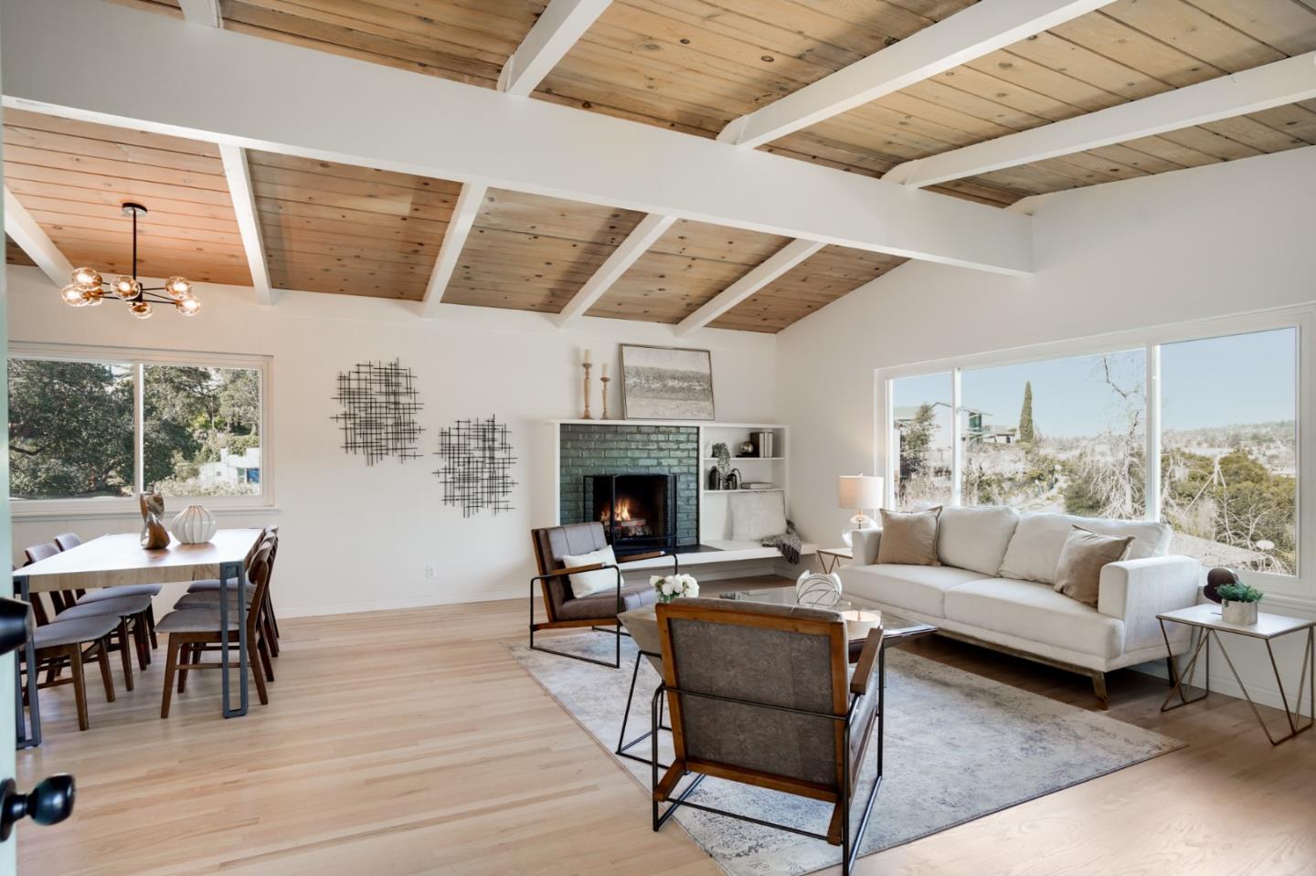 4615 Redding Street Oakland, CA 94619 - Photo 3 of 49 a living room with furniture a fireplace and a table