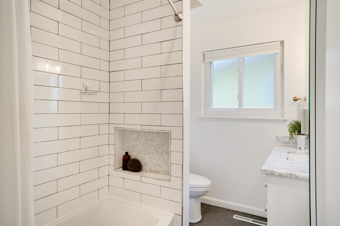 4615 Redding Street Oakland, CA 94619 - Photo 31 of 49 a bathroom with a sink toilet and shower