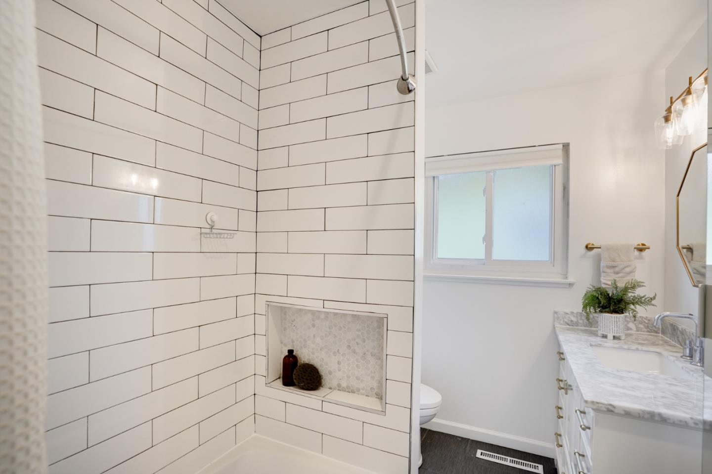 4615 Redding Street Oakland, CA 94619 - Photo 32 of 49 a bathroom with a sink and a mirror