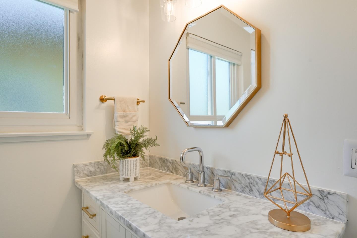 4615 Redding Street Oakland, CA 94619 - Photo 33 of 49 a bathroom with a granite countertop sink and a mirror