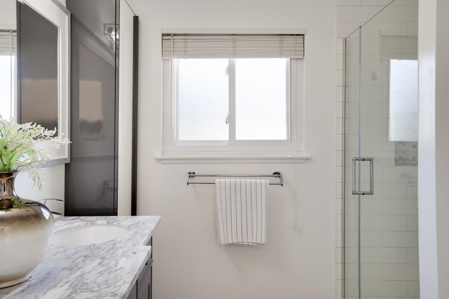 4615 Redding Street Oakland, CA 94619 - Photo 35 of 49 a bathroom with a bathtub and shower