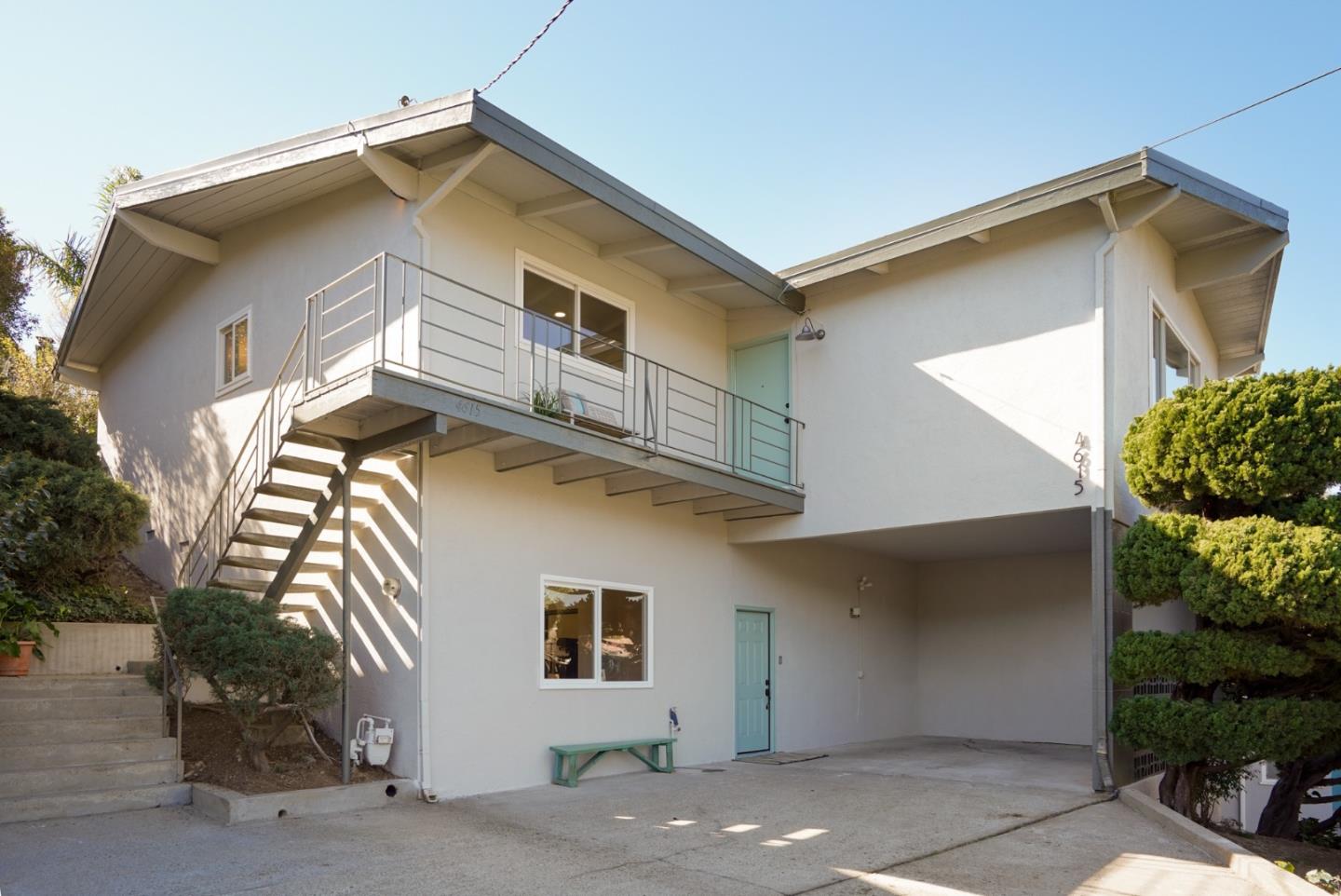 4615 Redding Street Oakland, CA 94619 - Photo 43 of 49 a view of a house with a yard and potted plants